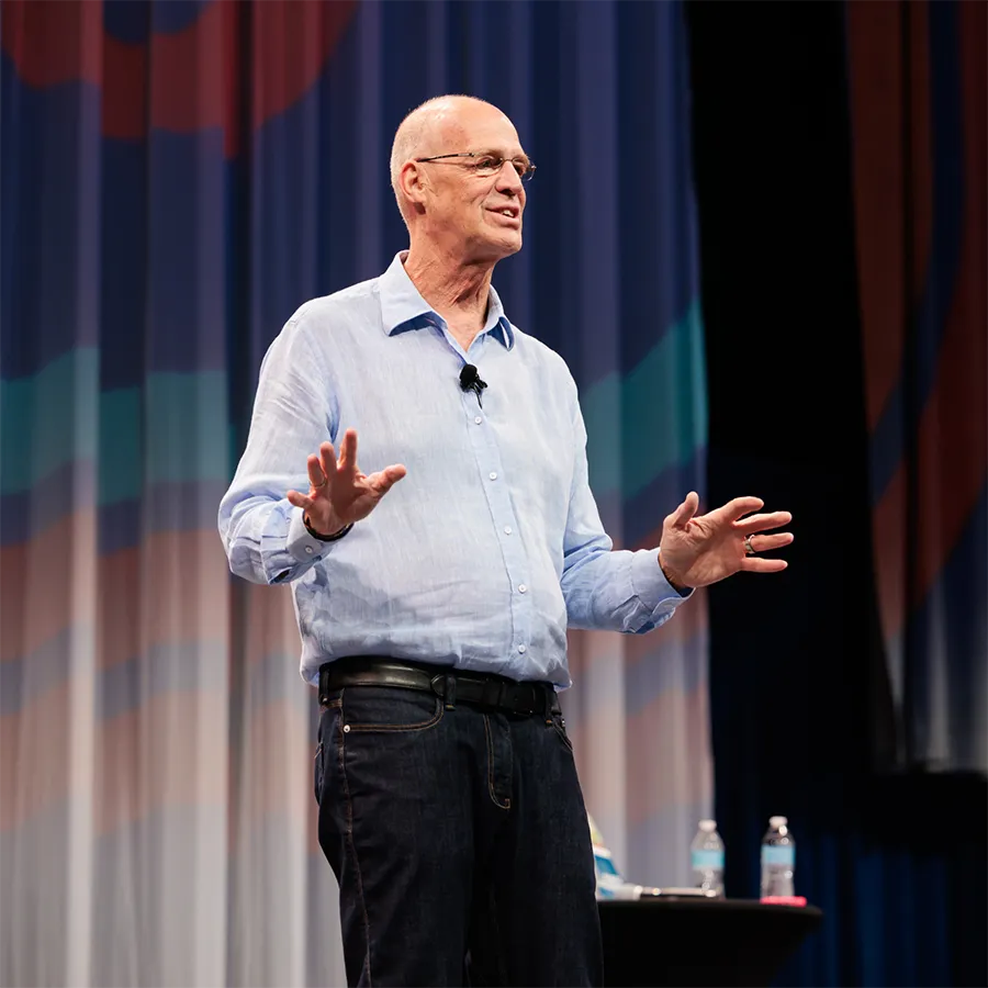 Bob Negen speaking on stage